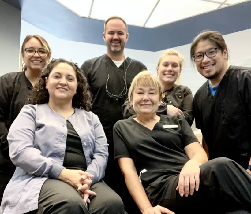Dodge City, KS dentist Dr. Austin Hrencher and his dental team