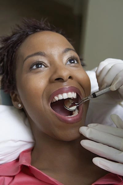 woman receiving a dental checkup at Hrencher Dental in Dodge City, KS