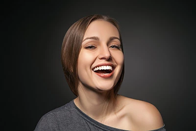 woman showing off her new dental fillings