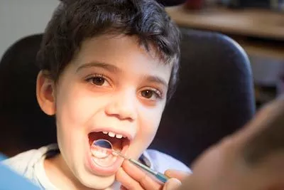 child getting a dental checkup at Hrencher Dental